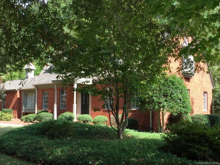 Lovely Williamsburg style home in Statesville Country Club. Brick exterior w/Hardiboard siding for easy maintenance. New exterior and interior paint. Some new fixtures. Updates throughout this spacious home. Den  with fireplace. Built-ins. Renai instant hot water. Large 2 car attached garage and heated and cooled detached 2 car two story garage with shop/bonus room above. Deck w/gas grill. The brick driveway leads to entry of brick and iron reflecting early Charleston "Compound" style.