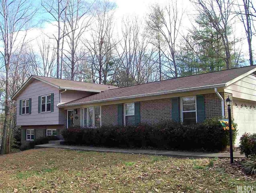 4 Bedroom 2 bath home on private .68 acre lot convenient to 1-40. Large formal living room with bay window and family room with fireplace. Double garage with cabinets for storage, nice yard with large patio. Lower level would make a great in-law suite, man cave, or home school area.