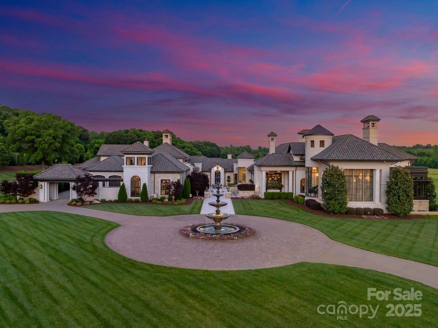 Welcome to one of the most exceptional private estates in the Carolinas. Situated on 13.22 acres in the heart of Davidson, this 24,018-square-foot residence under roof includes a 14,734-square-foot main home and a 1,990-square-foot guest house. Designed by architect Harry Schrader and built by Kingswood Custom Homes, the estate features five spacious bedrooms, six full baths, and three half baths. Interiors by Grace Thomas blend elegance with warmth and functionality. Behind the gated entrance, enjoy a private vineyard, professional-grade putting green, a resort style saltwater pool with multiple fire features, and expansive green space. The home is equipped with a state-of-the-art Savant Smart Home System and an advanced security system. Whether hosting on a grand scale or enjoying peaceful moments in total privacy, this estate offers luxury, comfort, and timeless design in one of Davidson’s most sought-after locations. This is more than a home—it’s a legacy.