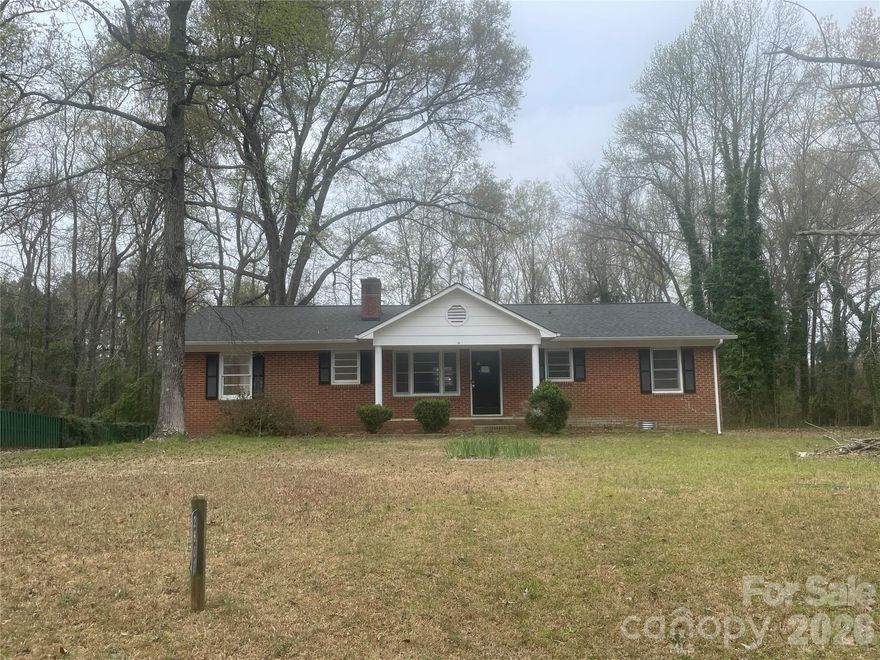 Spacious All Brick Ranch on 0.79 Acre Lot. Features include Granite Countertops with SS Appliances, LVP Flooring throughout, Fireplace in Living Room. 2 Full Bathrooms, Covered Front Porch and Rear Deck. Central HVAC. Two Car Carport. Property is being Sold As-Is.