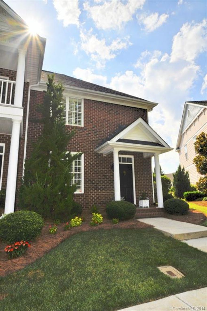 Full brick end unit Master Down townhome in popular Afton Village. Features extensive upgrades including moldings, built-in shelving, plantation shutters, hardwood floors.  Kitchen with upgraded 42' Maple cabinets & Granite counters. Master bedroom & courtyard were extended 6 feet when built.  Master suite also features a bay window, tray ceiling with custom lighting & stencil work, huge walk-in closet, double sinks, garden tub & separate shower. Brick courtyard with custom iron gate. Must See!
