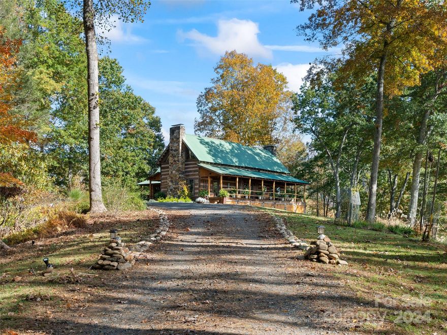 HUGE REDUCTION TO SALE - A SENSE OF PLACE-Like no other! Being in the right place & feeling it, is everything! THIS SENSUAL HOME, history galore, character beyond, love, beauty, & most of all, a feeling that words cannot describe. 3 pre-civil war log cabins relocated by Penland Artist, then reconstructed into an artistic estate.Current owners vision & appreciation for detail, along with a design team, took this magnificent abode & transformed it into the most captivating seductive retreat imaginable-EXCEPTIONAL LONG RANGE VIEWS-BEAUTIFUL RIVER VIEWS -PRIVACY-END OF ROAD-NO RESTRICTIONS-NO HOA'S-The vision the owner had for this property is beyond imaginable & captured to the T! As you step onto the covered porch & enter you will experience the abundant beauty, love, & care that has been put into this creation -DECKS-SPA POOL-FIRE PIT-GARDEN BEDS- WALKING/MEDITATION TRAILS all the way to the river! MUST SEE TO TRULY APPRECIATE  https://youtu.be/ZxFxBZ_rhww?si=M-TIxF2rbMGi6B_b