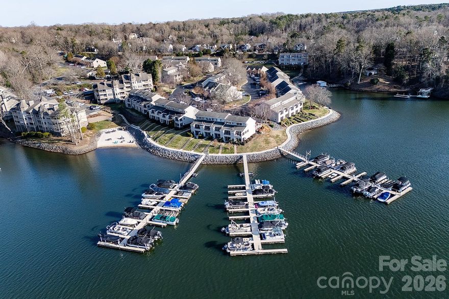 Beautiful waterside townhome living at The Yachtsman gated community on Lake Wylie.  Enjoy the serenity of this lovely 3 bed, 2.5 bath spacious home while living with club like amenities. Open concept, vaulted ceilings, hardwood floors and a gas fireplace make for fun and enjoyable living and entertaining. LR extends out to covered deck with fountain & pond views.  The cozy ensuite primary bedroom feels like a sanctuary with it's private enclosed porch. Bright modern primary bath with large soaking tub and elegantly tiled walk in shower.  Spacious second en suite bedroom with walk in closet. Walk in laundry with upper cabinets puts everything at your fingertips.  Upper level airy, light-filled loft style room is flexible space for bedroom/home office/gym. The resort style amenities include pool, tennis courts, private lakefront beach & picnic area as well as slips for docking your boat!  Prime location 10-15 minutes from shopping and dining at Shoppes at Rivergate, Berewick Town Center and the Charlotte Premium Outlets.