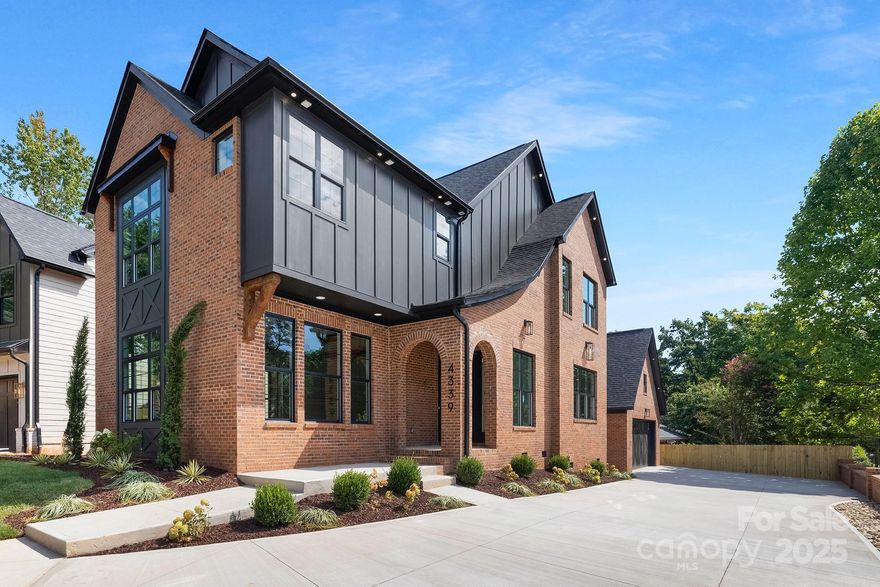 Discover refined living in this Northway Signature Series home, ideally located in the sought-after Madison Park neighborhood of Charlotte. Perfectly positioned on a corner lot, this residence offers over 3,000 square feet of beautifully designed space that blends modern comfort with timeless style. The open-concept main level showcases a gourmet kitchen with a large island, walk-in pantry, and seamless flow into the dining area and expansive living room. Abundant natural light enhances the inviting atmosphere, making it ideal for both everyday living and entertaining. Upstairs, the primary suite impresses with a spacious bedroom, spa-like bath, and dual walk-in closets. Two additional bedrooms and a versatile flex area provide plenty of space for family, guests, or a home office. A dedicated laundry room, two-car garage, and high-end finishes throughout further highlight the craftsmanship of Northway’s Signature Series. With close proximity to SouthPark, Park Road shopping, dining, and Uptown, this home offers the perfect balance of luxury and convenience.