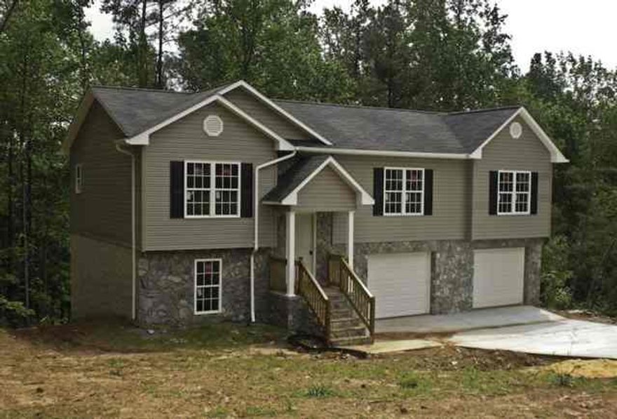 This newly constructed 3 bed, 2 bath home features custom cabinets, 2 car garage, cathedral ceiling, laundry on the main, one year warranty, and more.