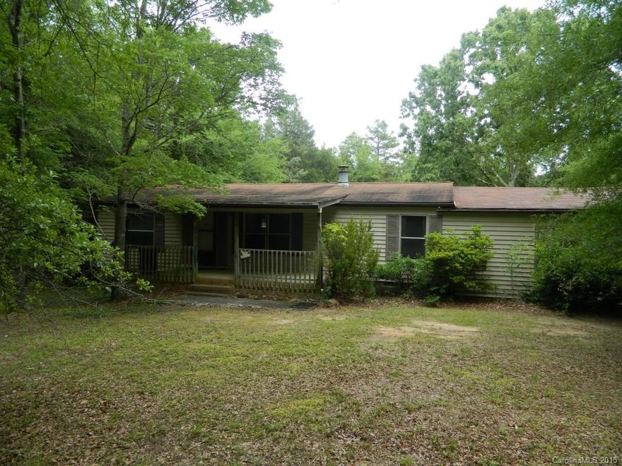 Almost 12 acres of quiet country living.  Complete with a private pond and quiet stream running through the back of the property.  Property being sold "as is".  Seller will make no repairs.  HVAC unit has been stolen.  Property could be subdivided by buyer and have several homes built.  There is no power or water currently turned on for this property.  It has been vacant for approximately 7 years per seller.  Come build you dream home here.  Convenient to shopping and low South Carolina Taxes.