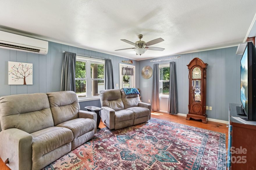 Wake up to the soothing sound of rushing water and mountain breezes in this beautifully updated 2BR/2BA home tucked along a bold Appalachian creek. Thoughtfully maintained inside and out, this cozy retreat features a jacuzzi tub, covered porch, carport, new roof, and brand-new 2024 mini-splits for efficient, year-round comfort.

The large, landscaped lot offers both peace and play — perfect for relaxing by the water, entertaining on the porch, or watching the seasons change across the mountains.

Located just minutes from ski resorts, the Blue Ridge Parkway, Harrah’s Cherokee Casino, and downtown Waynesville, this property blends natural beauty with unbeatable convenience.

Whether you’re dreaming of a vacation getaway, short-term rental, or full-time mountain home, this one has it all — modern comfort, timeless charm, and that unmistakable Maggie Valley magic.