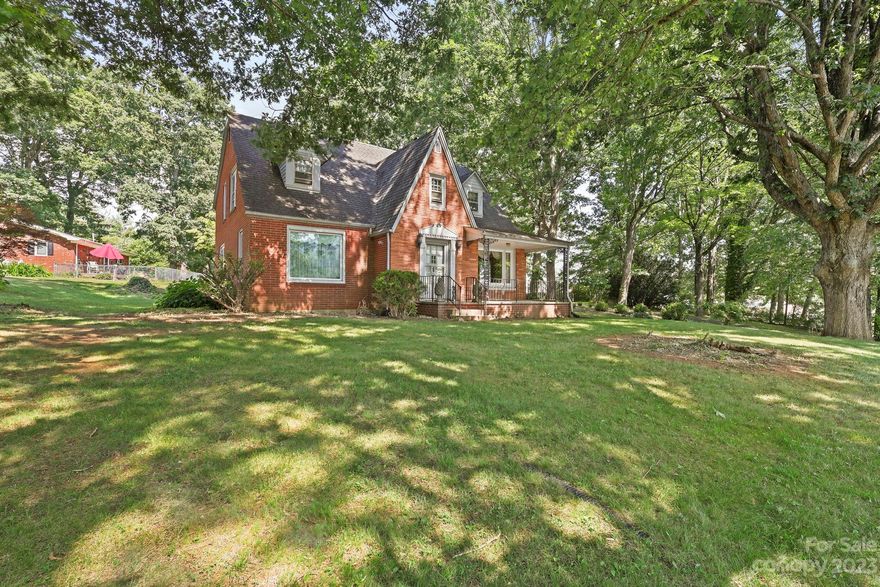 "Old world charm" at its best. This 50's home has a shaded and treed lot. Surprising spacious interior. It has a large kitchen with space for a dining area. The great room has parquet wood floors from the charm of the front door and the foyer with a direct view of the brick fireplace and the all-wood stairs. 2 bedrooms a full bathroom on the main floor. Follow the staircase up these stairs with charming "50's era" wallpaper to the 2nd floor, where you will find 4 bedrooms and a bathroom; only half possibly has the space to place a tub/shower. It is conveniently located within Jefferson, with shopping, dining, and local cuisine to the Blue Ridge Parkway, year-round outdoor activities like hiking and biking, and New River for canoeing, river tubing, and fishing. Want to run or have your own business? It will be a great location. Bring this "old world charmer" back to its' original charm. This is reflected in the price. FHA(203K) may be available for qualified buyers. Estate Sold "as is."