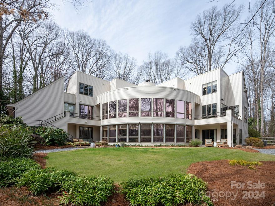 Why settle for the same Ordinary floorplan when you can have "Extraordinary".Immerse yourself in the timeless elegance of this spectacular Estate home.A masterpiece of modern architecture.Nestled in one of the sought after communities in Rock Hill, SC.The residence spans an impressive 7000+ sq.ft.Offers a harmonious blend of sophistication & contemporary design.The seamless integration of open spaces & sleek lines exemplifies the architectural brilliance.Spacious living areas, new gourmet kitchen w/ Cafe appliances, temperature controlled wine cellar;private sauna off Primary Bath; 2 home offices & expansive 2 story windows that invite natural light are just some of the highlights. Beyond the walls the property itself is a private sanctuary that encompasses 1.26 acres of lush landscaping.Embrace the opportunity to own a piece of architectural history & sit back & enjoy the recent improvements the homeowners have completed for you. One of the most impressive homes in the Charlotte area.