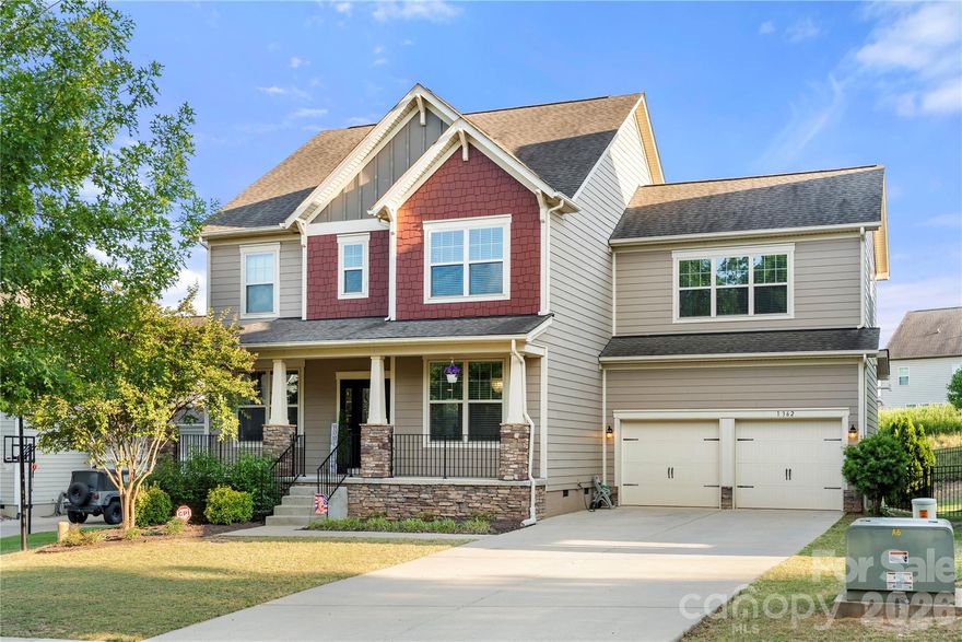 Come live in luxury at Waterside by the Catawba! One of Fort Mills most sought after neighborhoods. Situated at the end of a cul de sac street, and one of the premier lots in the neighborhood, this home boasts high end finishes and outdoor living space with good privacy. Many updates throughout the home include a California closet in the owner's ensuite, EV CHARGER in the garage and black iron fenced backyard. With its huge open floor plan and large kitchen island, family gatherings and friendly events are effortless. Pour out into the covered outdoor living space for extra space when needed or to enjoy the crisp morning breeze with a cup of coffee. The home office with French doors for extra privacy encourages the "work from home" model! Upstairs you'll find a large landing area and access to four bedrooms one bed/bonus room. All the rooms have great size and receive good natural light. The owner's suite includes a large bedroom space, dual vanity than wraps around, large soaking garden tub, free standing tiled shower, water closet and customized California closet. The bed/bonus room has a bathroom with a large shower and walk-in closet. The fenced backyard has a play set and is ideal for barbecues, gardening, pets and gatherings. There's has ample space for a pool and hot tub!