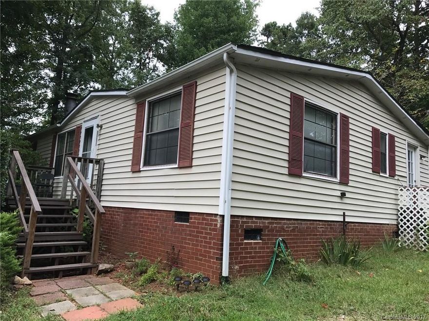 Home and over an acre of land! A barn & several large storage sheds are included. The land is really private and beautiful. Conveniently located in the HOT area of Denver NC yet on a dead end road. Lots of possibilities!