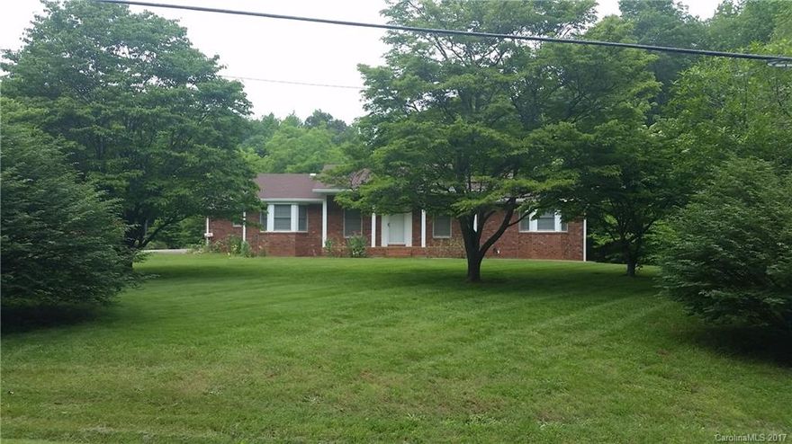 Beautiful home located on 6 acres with New wood floors through out Sun room is heated by a wall unit Full basement with a shower toilet and range ready to be finished a lot of potential.   Has a Double Garage attached and a Single Garage in Basement with a separate drive way to it.  Beautiful land and private with it only being 1 mile to I-85