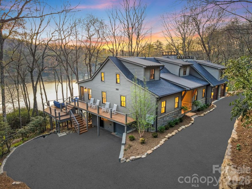 Presenting the most exquisite turnkey modern mountain home, fully renovated and newly constructed! Perfectly located on the highly desired but rarely available Lake Cardinal within the exclusive Lake Toxaway Estates, just minutes from the Lake Toxaway Country Club, Golf Course, marina, and the Greystone Inn! Curated by a top-notch design build team, quality and attention to detail are evident throughout this stunning home! The 1st floor features a graceful double door entry with views straight through to the lake. The open floorplan includes walls of windows with unobstructed water views, an incredible Great Rm with 16'+ vaulted ceilings, stone fireplace, beamed ceiling, and access to the large, covered deck with fireplace and outdoor grilling station! The chef's Kitchen will delight with Quartz counters, Thermador appliances, and oversized island. Gather in front of the cozy Hearth Rm fireplace and still be part of all the activity. The luxurious Owners Suite offers utopian lake views, a Sitting area, custom spa Bath, and walk-in Closet! Access to the 2 car Garage, Pantry / Laundry Center, firepit Deck, and 1/2 Bath complete the main level. Upstairs you will find 2 Ensuite Bed Rms, each with gorgeous Baths, along with a Loft area, perfect for reading or an Office, all with exceptional Lake Cardinal views! Downstairs is a huge Family Rm with Bar, and access to 2 other Decks. There is a perfect Flex space or Den with full Bath, a lower level Kitchen with outdoor access, and 1/2 Bath. Another 2-car tandem Garage (4 car total) and lots of storage space round out the Lower Level. The site boasts over 150' of waterfront access through the landscaped paths to the dock. Nestled on 1.8 acres, the 65 acre Lake Cardinal offers the most spectacular lakefront experience, with just a few homes, where you will enjoy peace and tranquility undisturbed by noise or wakes from the main lake. Lake Toxaway is the largest private lake in NC! Updates include new mechanicals, roof, windows, appliances, cabinetry, trim, decks, lighting and flooring. Home can be purchased complete with all new designer furnishings! Adjacent 2.5 acre building site complete with 4 Bed Rm approved septic and lake access also available.  Membership to Lake Toxaway Country Club through application and availability.