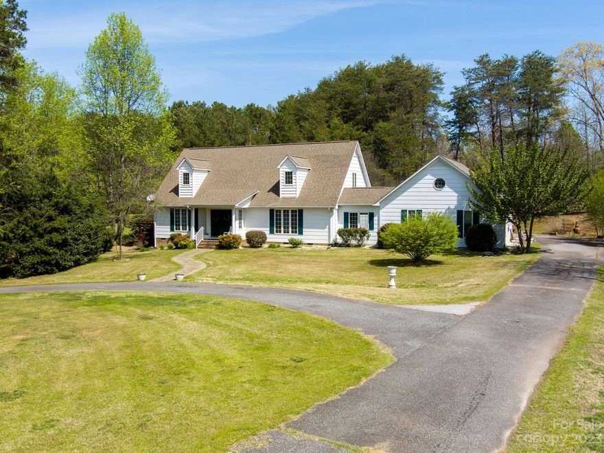 This charming farmhouse perfectly set on just under 2 acres is waiting for you. Inside you'll this peaceful retreat to be incredibly inviting, surrounded by huge windows, open floor plan and high ceilings. On the main floor you'll find the primary bedroom with huge bathroom and walk in closet.  Upstairs is an additional sitting area and bedroom with ensuite bathroom. There is plenty of room for all of your equipment in the large garage and storage buildings. Bring all your things and escape the bustle of the day while being conveniently close to downtown, shopping and the interstate!!