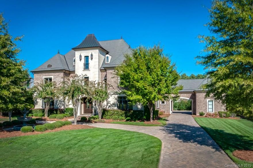 Lovely French Chateau located in gated, golf community, exudes warmth and elegance throughout! Luxurious details incl oversized moldings, unique lighting fixtures and top of the line appliances. Exquisite grand entry w/ dual staircases glows in bright, natural light. This wonderful floor plan with easy flow offers opt. main level or upper level owner suites. Fabulous kitchen w/ 15 ft. walnut island is open to the great rm and breakfast. Covered porch and patio w/ fireplace for dining al fresco!