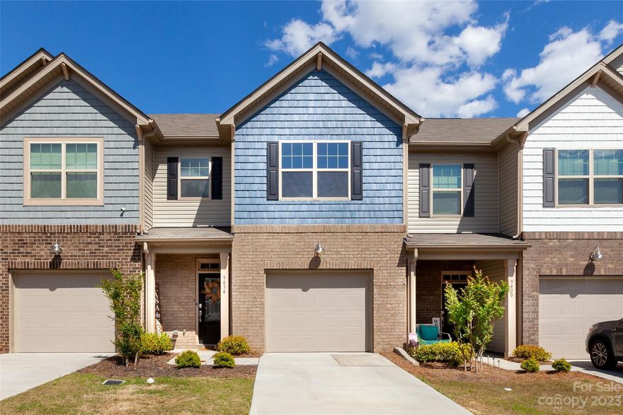 Welcome to The Greens!! Why wait for new construction when you can own this gorgeous, like new townhome in booming Indian Land. Enjoy a large, open floorpan overflowing with natural light and custom features. Come home to a welcoming living room, dining area and spacious kitchen (complete with quartz countertops, custom & modern cabinetry, eat-in island, stainless steel appliances, pantry, and gas range). The second floor hosts the primary ensuite featuring a beautiful wall of windows and sitting area, tile bathroom flooring, dual vanity, luxury walk-in shower, and walk in closet. A second ensuite bedroom with private bath and large walk in closet rounds out the second floor. The community boasts side walks and a relaxing swimming pool- perfect for easy living with walkability and access to local shopping and dining. Welcome Home!