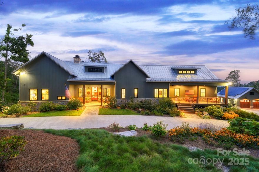 Custom-built in 2021 by Mountain Sound Builders, this exceptional home on a 10-acre double lot in Elk Mountain Estates offers spectacular year-round long-range mountain views(Furnishings are negotiable). Open-concept kitchen features a large island, high-end appliances, and flows into a living room with a wood-burning fireplace (currently using gas logs). Enjoy a three-season screened porch with its own fireplace, Azek TimberTech decking, and premium finishes throughout—6” engineered hardwoods, radiant floor heating, custom closets, roller shades, and built-ins. Energy features include solar panels, a 48kw Generac generator, tankless water heater, and an EV hookup with Tesla battery. Detached, heated garage fits 3 vehicles (5 total, including attached garage), with custom shop space below. Additional perks: standing seam metal roof, fiber internet, whole-house filtration, central vac, Sonos sound, and epoxied floors. This meticulously landscaped private mountain retreat has unmatched quality. A must-see place!