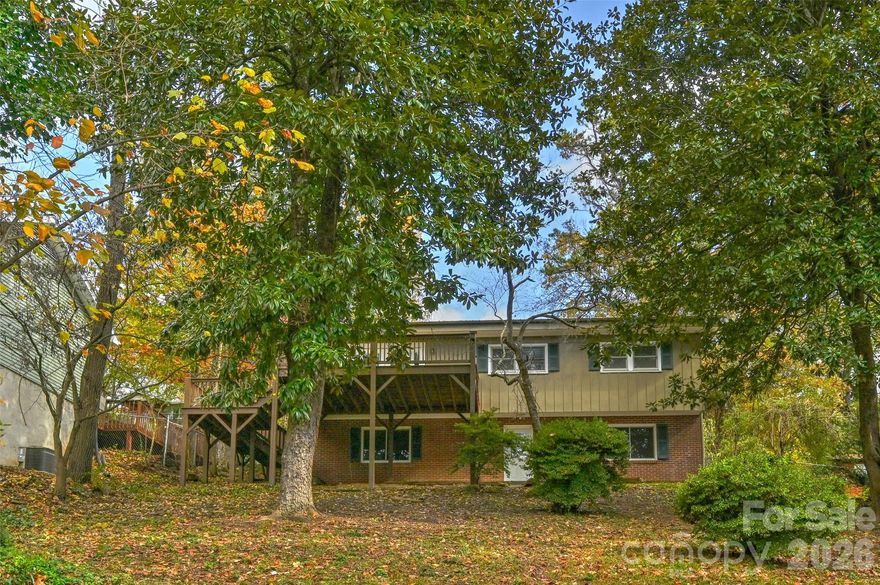 --Motivated Seller--

Lake views, extra parcel with lake access, and major system upgrades—this Kenilworth home checks all the boxes!

This 4-bedroom, 2-bath home sits in one of Asheville’s most sought-after neighborhoods, just minutes from downtown, with peaceful views of Kenilworth Lake. An additional parcel across the street borders the lake, offering rare extra space and direct access for outdoor enjoyment.

Inside, the home has been thoughtfully updated with fresh interior paint, brand-new vinyl plank flooring, new bathroom vanities, and a new stainless steel refrigerator and stove. The layout offers flexibility for full-time living, a second home, or investment potential.

Recent major improvements provide confidence and value, including a new roof and gutters (2026), heat pump (2024), and upgraded electrical service and meter base (2024). The chimney system was also improved with a new crown, grout repairs, and waterproofing (2022).

The basement is already plumbed for an additional bathroom, creating an easy opportunity to expand finished space and increase value.

Enjoy the charm of Kenilworth with the convenience of being just minutes to downtown Asheville, hospitals, and local amenities—plus the added bonus of lake access with the additional parcel.