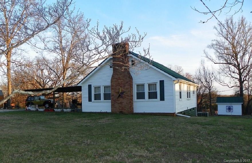 Country living on this Mini Farm close to I-77.  This 5 acre mini farm has a newly remodeled home, the land is partially fenced, has a 2 story barn with extra covered storage, and a workshop. There is a new roof, new vinyl siding, vinyl windows, and many other updates.  Basement is good for storage but also has partial crawlspace that is visible from basement.