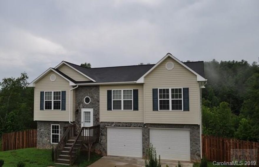 Whether you are looking for your first home purchase or a home with more space, this home is worth seeing. This 3 Bedroom 2 Bath home is nestled in a very nice neighborhood in the Morganton area on 1.25 acres. A spacious home with an open floor plan that shows hardwood flooring accenting the Living Room, Kitchen, and hallway leading to the Bedrooms. Master Bedroom is carpeted and has a Master Bath with a shower tub combo. A large Kitchen with countertop and cabinet space will lead you to the back deck and privacy of the back yard. The unfinished Basement makes a great storage area for your extra storage needs. Enjoy grilling and entertaining on the back deck, the beautiful weather, or rest in the privacy of the partial fenced in back yard.