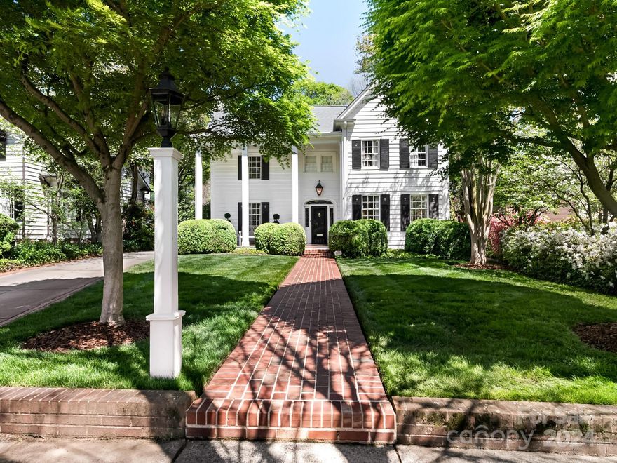 Classic Myers Park home features a top-to-bottom renovation and exudes luxury and charm! Gorgeous hardwoods on both floors and 9 ft’ ceilings on the main level. Designer fixtures and finishes throughout. Covered rocking-chair front porch opens to the elegant formals and the spacious family room and rear mud room are perfect for everyday living. Chef’s kitchen features marble countertops, butcher-block island, high-end stainless appliances (including Wolf gas range) and walk-in pantry, plus breakfast room with built-in dining banquet. Expansive Primary Suite with 2 walk-in closets and stunning marble bath with soaking tub and oversized walk-in shower. Laundry room upstairs. Covered back porch with brick fireplace plus patio. Detached 2-car garage with incredible apartment above offers 5th bedroom and full bath!  Full house generator and new water heater. Too many custom features to list- meticulously maintained and in pristine move-in ready condition!