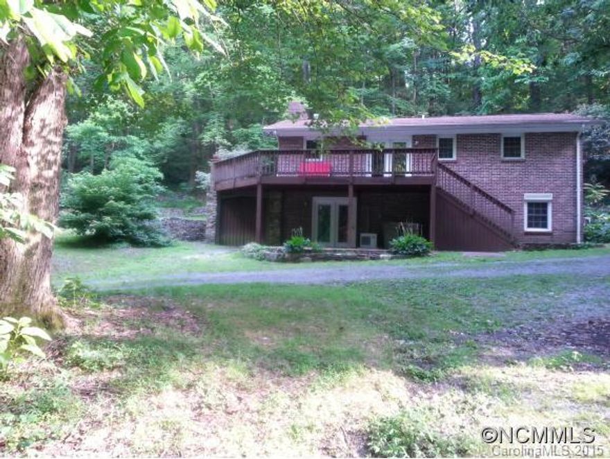 LOCATION!!LOCATION!!LOCATION!! This ranch style brick home is a must see!! AS IS, sitting on .63 acres of privacy and tranquility. Home features large master on main with a possible 3rd large bedroom.Freshly painted, updated kitchen and bathroom, brick fireplace in family room, large wrap around deck for entertaining and so much more.BRING ALL OFFERS!!