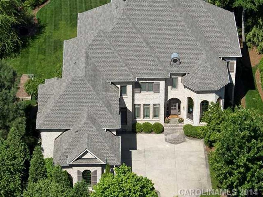 Beautiful lake front home at end of cul-de-sac. Expansive,unimpeded water views of large, peaceful cove off main channel. Deeded boat slip and lift. Private boardwalk. Large gourmet eat-in kitchen/great room, looking into the lake. Elegant living room, two story music room. Covered porch and screened dining with sunset views. Three room second floor master suite with kitchenette