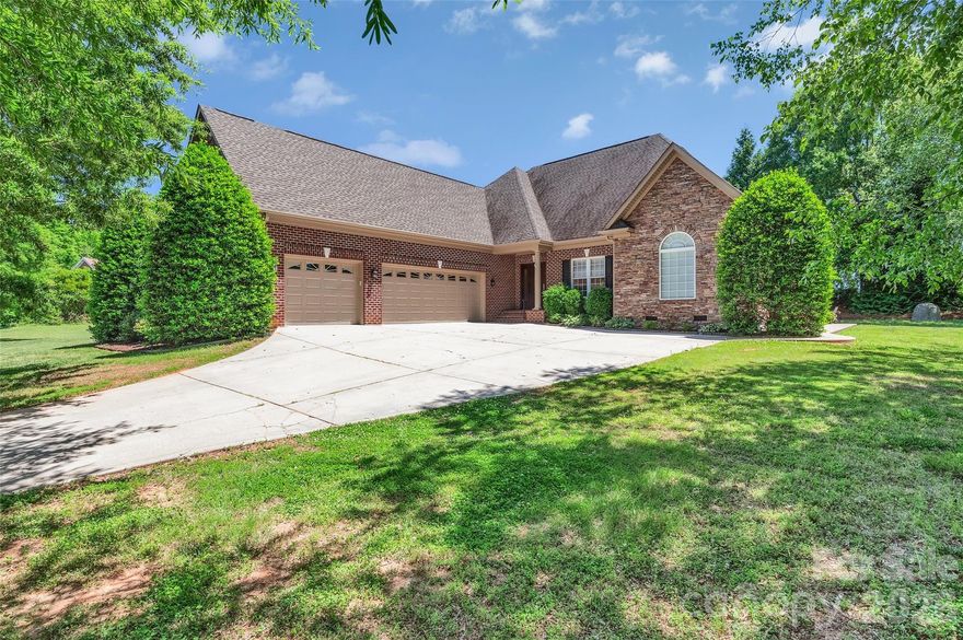 Discover the perfect blend of privacy and convenience at 8007 Fletcher Court, situated on a sprawling 1.33 acre lot just two miles from downtown Waxhaw. This freshly painted four-bedroom home features a refined interior highlighted by hardwoods throughout the main living areas, custom built-ins, and luxury-level crown molding. The heart of the home is the kitchen, featuring built in oven, ample cabinet space, pantry and gas cooktop. The kitchen flows into a bright, beautiful sunroom overlooking mature trees and the private backyard.

The main floor primary suite offers a spacious sanctuary with a large tiled shower. This split floor plan includes 2  spacious bedrooms and full bath on the main floor. For a total of three bedrooms and 2.5 baths.  Upstairs, you will find a generous bedroom, full bath and two large flex spaces. The home offers incredible storage solutions, including a huge walk-in attic and multiple linen and coat closets. Set on a lush lot with a wooded backdrop, this residence provides an exceptional amount of space and high-end detail in a prime location.