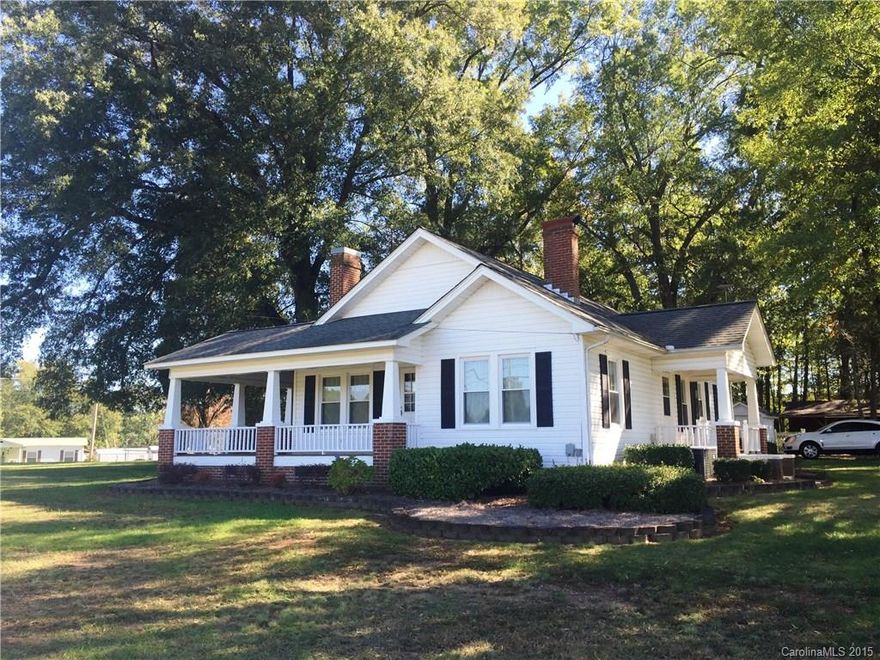 Beautiful "Farm House" setting convenient to everything. Quaint, all vinyl-sided home with wrap around porch. Great storage.