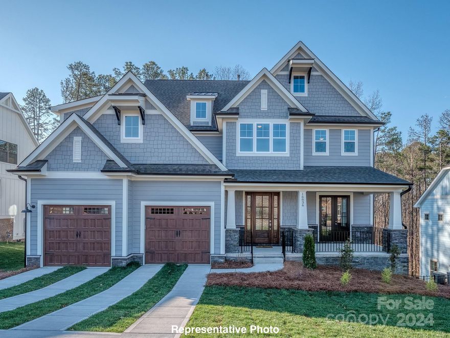 This beautiful multi-generational basement home features a bedroom/study with ensuite bath on main, great room with fireplace, kitchen, large butler's pantry, dining room and a covered deck overlooking hardwoods. The second floor features a primary bedroom, three secondary bedrooms, three baths, a large laundry room and bonus room. The basement features a second living area complete with 2nd primary bedroom, living room, kitchen, dining and workout room or home theater room. The home is completely wired for networking, speakers, and security. This is a perfect home for multiple generations in need of their own space. The home is adjacent to the Palisades community, close to Lake Wylie, Palisades Episcopal School, Palisades Country Club, and Palisades High School. This beautiful new home is move-in ready with the peace of mind only a builder backed warranty can bring and of course that unmistakably wonderful new home smell!