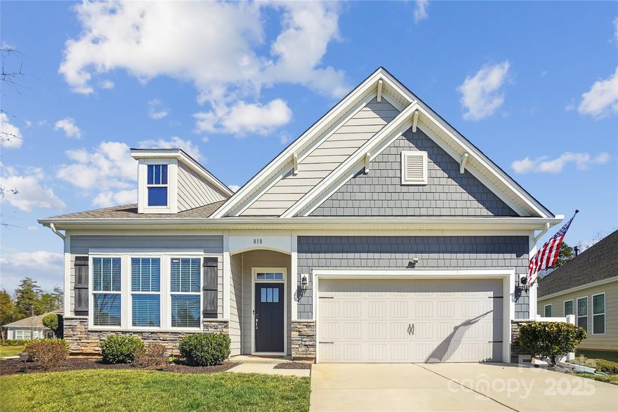 Meticulously maintained 1.5 story on oversized corner lot, overlooking large community green space. Open concept featuring 10ft. ceilings, light, bright kitchen with beautiful expansive granite island. Primary suite with tray ceiling, dual vanity and large tiled shower. 4th bedroom with full bath, large flex/bonus room and walk-in attic completes the upper level. Luxury vinyl plank floors and crown moulding throughout main floor living areas, carpet in all bedrooms and upper level. Neutral ceramic tiled bathrooms with framed mirrors. Gas fireplace with blower, faux wood blinds, ceiling fans and 36" doors throughout. Professional epoxy floor in extra deep garage with storage racks. Covered rear porch with large extended patio overlooking tree lined, beautifully maintained backyard. Abundant community amenities include pool, playground, pickleball, fitness center and clubhouse. Close to Lake Wylie and Charlotte with low SC taxes and award winning schools. This home is better than new!