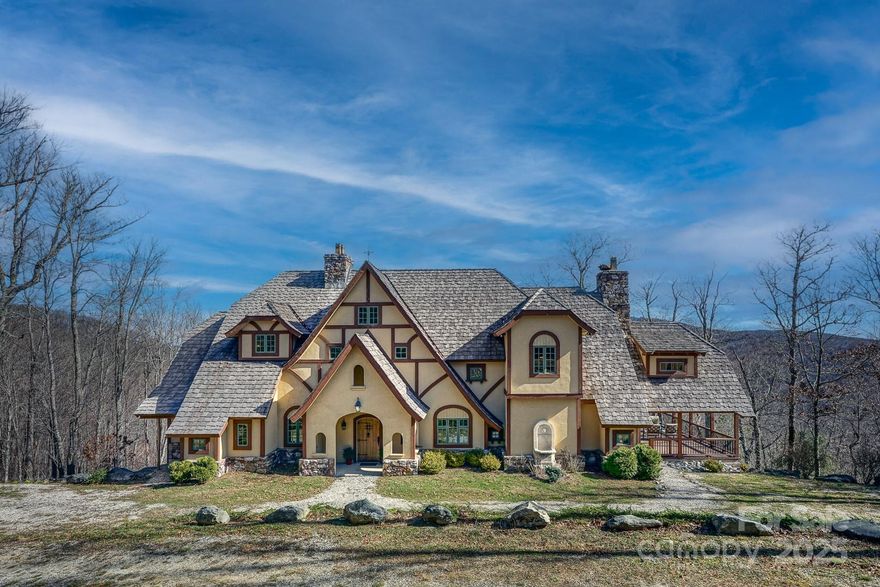 Unparalleled Grandfather Mountain Views. Nestled within the gated community of Linville Ridge, this storybook home was designed in collaboration with Dahl Delu, a renowned Hollywood set designer, and Roger Murray Leach, famed for his work in film and architecture. This home blends timeless elegance with breathtaking mountain surroundings. Perched to capture the finest views of Grandfather Mountain, visible from nearly every room. Featuring eight fireplaces and walnut flooring, this residence is designed for both comfort and sophistication. For those seeking privacy, the adjacent lot is also available while the acreage behind the home is protected by a conservation easement, ensuring an undisturbed natural backdrop. Linville Ridge membership is available for an additional fee. This home has storm damage and priced well below market value.  $87K credit with acceptable offer toward new roof. Home was pre-inspected and report available. Plan features five ensuite bedrooms; septic is 3.
