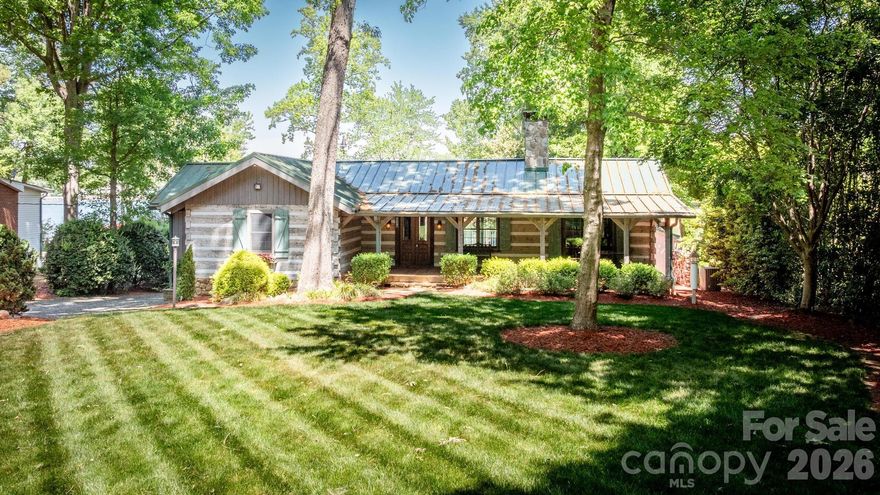 Beautiful Waterfront Cabin on .641 Acres w/No HOA's! Park Like Waterfront Lot w/Wide Open Views! Great Room w/Stone Fireplace, Kitchen Open to Dining Area, Primary Bedroom w/Three Closets, Primary Bath w/Double Sink Vanity & Walk-In Shower, Secondary Bedroom on Main Floor w/Additional Full Bath, Finished Basement w/Family Room, Two Additional Flex Rooms, Laundry Room & Full Bath. The Basement is Fully Finished However The Ceiling Height is 6'8" and the Standard Height Required Is 7'. Home Is Being Sold "As Is Where Is Seller To Make No Repairs" The Value Is In The Magnificent Lot! Excellent Location Close to I-77, Waterfront Restaurants, Shopping, w/Low Iredell County Taxes & Award Winning Schools.