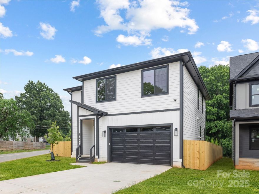 Introducing a stunning new construction home by Northway Homes, part of their Signature Series, located on a corner lot in the growing Enderly Park neighborhood. This 4-bedroom, 3.5-bathroom home blends timeless style with modern design. The main level features 10-foot ceilings, an open-concept layout, and a chef’s kitchen with a large island, walk-in pantry, and bright breakfast nook. The spacious living area with a cozy fireplace is perfect for entertaining, and a convenient powder room adds functionality. Upstairs, the luxurious primary suite includes a spa-like bath and oversized walk-in closet. Three additional bedrooms and two full baths offer space for family or guests. Thoughtful design, premium finishes, and quality craftsmanship are found throughout. Enjoy elevated living just minutes from Uptown Charlotte, the city’s vibrant west side, and the bustling Wesley Heights neighborhood.