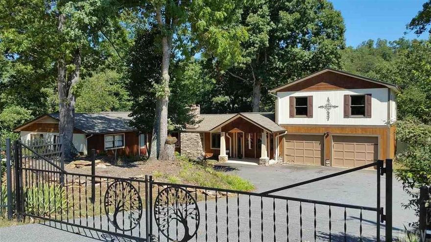 Beautifully remodeled one level home on Lake Hickory with 230+/- Ft deep water frontage. Custom designed stained glass herons welcome you home. Walk through the breezeway out onto the deck with panoramic views over a wide finger above Sandbar Cove. Extensive perennial gardens detail this house with hosta, hydrangea, azalea and more. This property includes a spacious great room with cathedral tongue & groove pine ceiling over a wood-burning stacked rock FP and easy care laminate flooring, kitchen offers granite tiled countertops, mahogany cabinets around SS appliances and movable granite island for extra seating. Just off great room is a full bath for guests. Around the corner find the spacious master suite with jetted tub and walk-in closet. Next door you'll find the large W&D closet with shelving, 2nd bedroom, den and a flex room for office/gym/etc. All this on just under an acre with easy access to the water via wood dock in place to enjoy Lake Hickory.