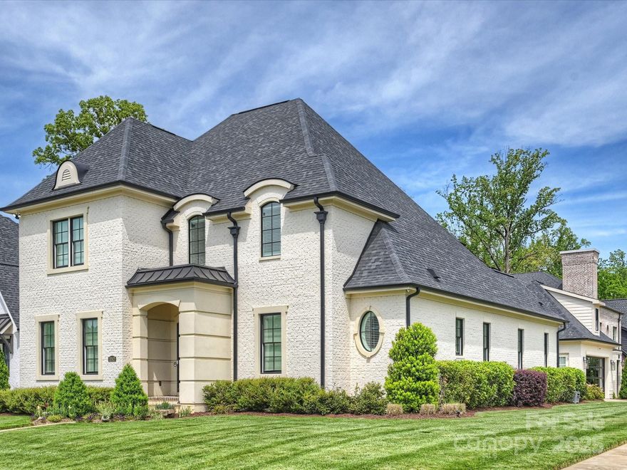 Gorgeous custom home located in premier Cramer's Pond neighborhood, minutes from Uptown and walking distance to Charlotte Country Club. Positioned on a lovely corner lot, this 4BR/3.5 Bath boasts over 4000 square feet. This beautiful property features 11 foot recessed soaring ceilings, an open concept floor plan w/ beautiful natural light throughout. Gourmet kitchen is a showstopper featuring an oversized quartz island, custom bright cabinetry and a hidden walk-in pantry. Off of the great room you’ll find seamless sliding glass doors to a covered porch w/gas fireplace ideal for indoor-outdoor living and entertaining. Primary suite on main features vaulted ceilings, his & her vanities and an expansive walk-in closets. Upstairs boasts two additional bedrooms, a HUGE bonus room w/ wet bar beverage and secondary laundry. WALK IN storage you’ll have to see to believe. Side load 2 car garage w/ modern glass door. No detail overlooked on this one! Don’t miss it!