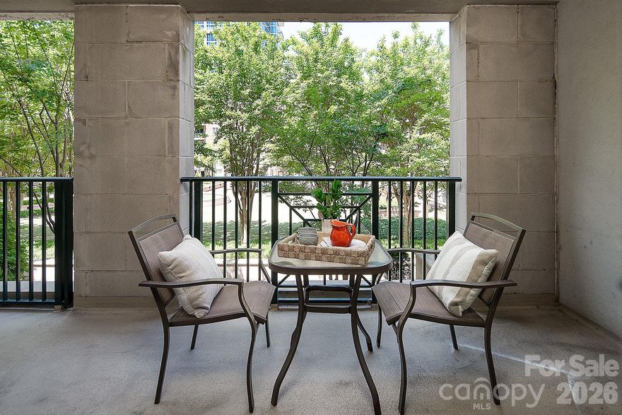 Premier location within coveted Fifth and Poplar Condominium community!  As this one bedroom unit is set above a lush, professionally landscaped courtyard, the residence captures the feel of a private resort retreat. This home stands apart for so many reasons: extra square footage with an entry foyer, hardwood flooring in the main living, large covered balcony, new HVAC system and a deeded storage locker.  Assigned parking in the secure gated garage.
Fifth and Poplar is a unique community in Charlotte:  truly a village.  Steps away from sports, theatre and dining of Uptown, Fifth & Poplar is tucked behind majestic gates into the leafy serenity of tree lined streets of the Fourth Ward. 
5th & Poplar is just blocks from all the sports stadiums & arenas, dining, museums, theatre, the light rail and situated between parks. Be privy to Friends of Fourth Ward events especially the highly anticipated Secret Garden & Home Holiday Tours! Building updates: New roof 2023, hall carpet & paint 2022. LIVE THE TURN KEY RESORT LIFESTYLE AT 5TH & POPLAR: FULL TIME ON SITE CONCIERGE & AWARD WINNING ON SITE HOA management., pool w outdoor kitchen, professionally landscaped gated courtyard w putting green, fountain, dog park, state-of-art fitness center, cozy library w gas fireplace, fireside terrace w TV & grills, media room, cyber & coffee cafes& resident car wash. 2 full time supers & maintenance staff, HARRIS TEETER, NAIL SALON & DRY CLEANERS in the building. Digital bulletin board. On and off site activities including Book Club, Coffee & Conversation, Happy Hours, Bingo & More!
