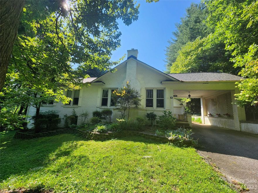 Beautiful 1910 brick home on shady lot close to downtown Hendersonville.