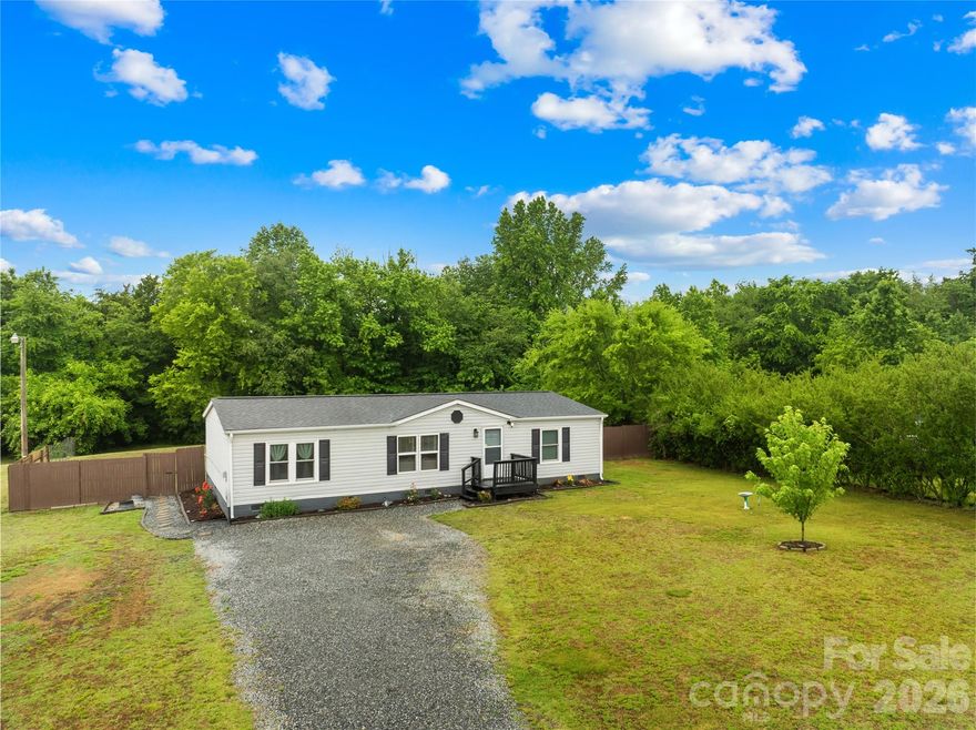 Welcome to this inviting 3-bedroom, 2-bath home tucked away at the end of a quiet cul-de-sac, offering privacy, space, and flexibility both inside and out. Situated on a spacious lot with expansive front and backyard areas, this property provides plenty of room for entertaining, gardening, pets, outdoor activities, or simply enjoying extra space to spread out.

Inside, you'll find a spacious kitchen designed for everyday living and gathering, complete with a sliding glass door leading outside and creating a seamless indoor-outdoor flow with plenty of natural light. Thoughtful updates include updated windows throughout most of the home (excluding the two front living room windows, which were previously replaced), along with beautiful new Smokey Oak luxury vinyl plank flooring throughout the main living areas, adding both style and durability to the home.

One of the standout features of this property is the freedom of no HOA, giving you more flexibility to truly make the property your own. The home also includes an RV hookup, making it ideal for travelers, guests, or additional convenience and functionality. Conveniently located just minutes from Troutman, you'll enjoy easy access to shopping, dining, parks, local conveniences, and nearby amenities while still enjoying the peace and quiet lifestyle. This home offers the perfect combination of comfort, space, updates, and convenience. Book your showing today!