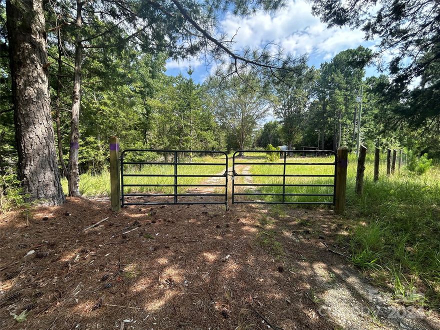 Nestled in the serene countryside of Carlisle, SC, this beautiful 27.80-acre parcel offers a perfect blend of rolling hills, partially cleared spaces, and natural woodland. The land features a seasonal creek and comes ready for your dream home with a well already installed. Whether you're looking to build a peaceful retreat or seeking a hunting property rich in wildlife, this versatile land provides endless opportunities. Located just 18 minutes from Chester, 24 minutes from Union, and 10 minutes from Lockhart, you can enjoy rural living with convenient access to nearby towns. A recent survey has been completed, making this an ideal investment or personal getaway. Don’t miss this rare find!