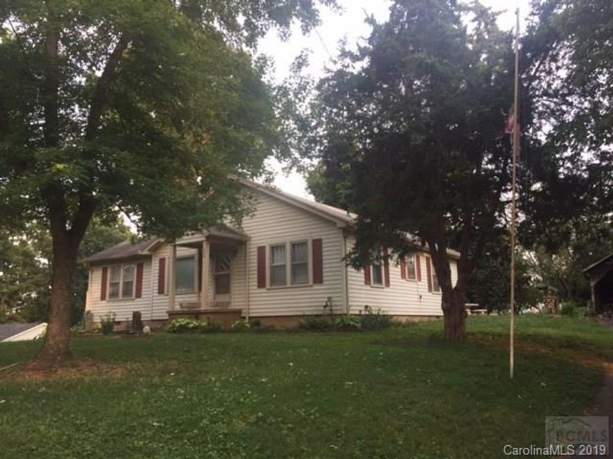 Nice bungalow in Morganton. home, with over 1050 SF features living room with fireplace, kitchen/dining area, three bedrooms, 1 bath, back porch, and laundry. Situated on a 0.47 acre lot with nice landscaping.