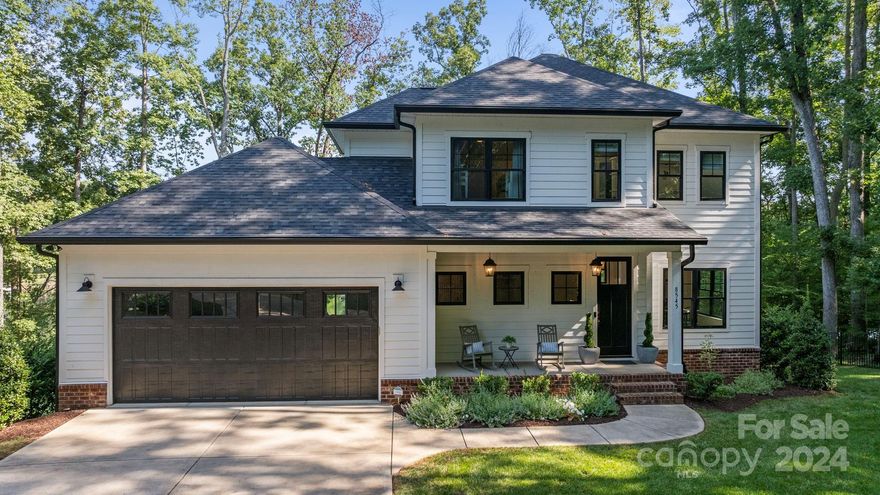 Escape to this remarkable waterfront home that offers an incredible opportunity to embrace lakefront living. Privately situated, this property allows for stunning views in a tranquil setting. The open floor plan allows for you to move freely, while the abundance of natural light fills the home. From the great room and kitchen, step out onto one of the many outdoor entertaining spaces. You'll find the bedrooms upstairs, with the primary suite offering a private deck, as well as a stunning primary bath. Relax in the basement recreation room, with easy walk-out to the patio and lush backyard. Cozy fire pit by the private beach provides year-around spaces to enjoy, while the private dock provides beautiful views of the lake. Don't miss the outdoor shower and the abundance of storage for all your lake activities. This one is truly special!