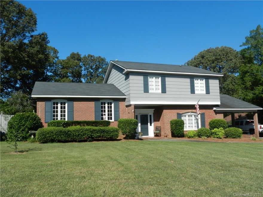 Wonderful home w/4 bedrooms and attached second living quarters.  This home features both formal LR & DR w/hardwood floors and den w/fireplace and separate breakfast room. This home has built-in TV niche bookcase and glass display cabinet. Also included in this home is a fenced in yard w/a 2-car detached garage and storage building. Lots of house in convenient location.