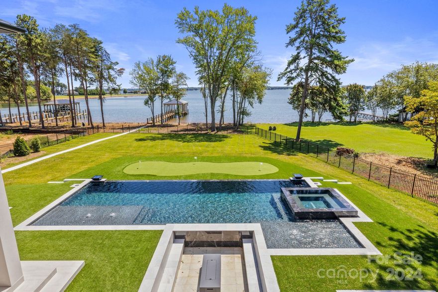 Experience Lake Norman, uninterrupted, from the comfort of this new build where contemporary elegance is defined and magnificent long-range views are unparalleled. The timeless "Florida Inspired" architecture from Sater Design came to life through the meticulous oversight of builder, LH Waterfront Construction. Built to entertain, the residence captures the perfect balance of symmetry and serenity and boasts over 12,400 square feet of covered space to host year round events both indoors and outdoors. Marvel at the Carolinas revolving seasons and experience an incomparable lifestyle on the shores of Lake Norman, encompassing over 500 miles of picturesque shoreline with vibrant sunsets, waterfront dining, relaxing cruises, and exciting regattas. 123 Saylors Watch is a stunning example of modern architecture, beauty and luxury in one complete package, raising the bar and setting a new standard for luxury living in North Carolina.
