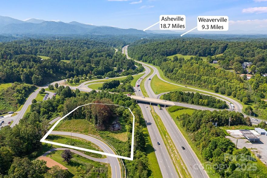 Position your brand where the mountains meet the interstate. This 2± acre C-2 Highway Business site sits directly off Exit 11 in Mars Hill, capturing travelers and locals with unmatched two-direction I-26 exposure. Heading north, it’s the last full-view stop before Burnsville or Johnson City; heading south, it’s the last full-view stop before Asheville—perfect for destination signage, quick stops, and convenience-driven uses. Nearby demand drivers include Mars Hill University (1,000 students) and a local base of 2,200 residents, with two new multi-unit subdivisions along Crossroads Parkway adding rooftops and daily-needs trips to the trade area.
The C-2 district is designed for businesses that rely on automotive traffic and major-highway frontage. Permitted uses include automobile sales & service, automobile service stations, farm equipment sales, retail & service businesses, motels/hotels, restaurants/QSR, banks & financial services, professional offices, funeral homes, animal hospitals/veterinary, taxi/bus stations, car wash, laundries, contractors, electrical, public facilities, indoor amusement/entertainment, tattoo studios, and shopping centers by special use. (Buyer to verify specific plans with the Town of Mars Hill.)
With interstate-scale visibility, this tract fits a single flagship user, multi-pad layout, or hospitality concept. Add strong signage, design efficient access, and let the corridor do the marketing for you.
Utilities: City water, sewer, and natural gas available; buyer must apply & receive approval from Town officials for annex into the City limits, prior to water/sewer connections (Verify availability/capacity, taps, and fees). 
Town of Mars Hill Zoning Ordinance file is available in the attachments.