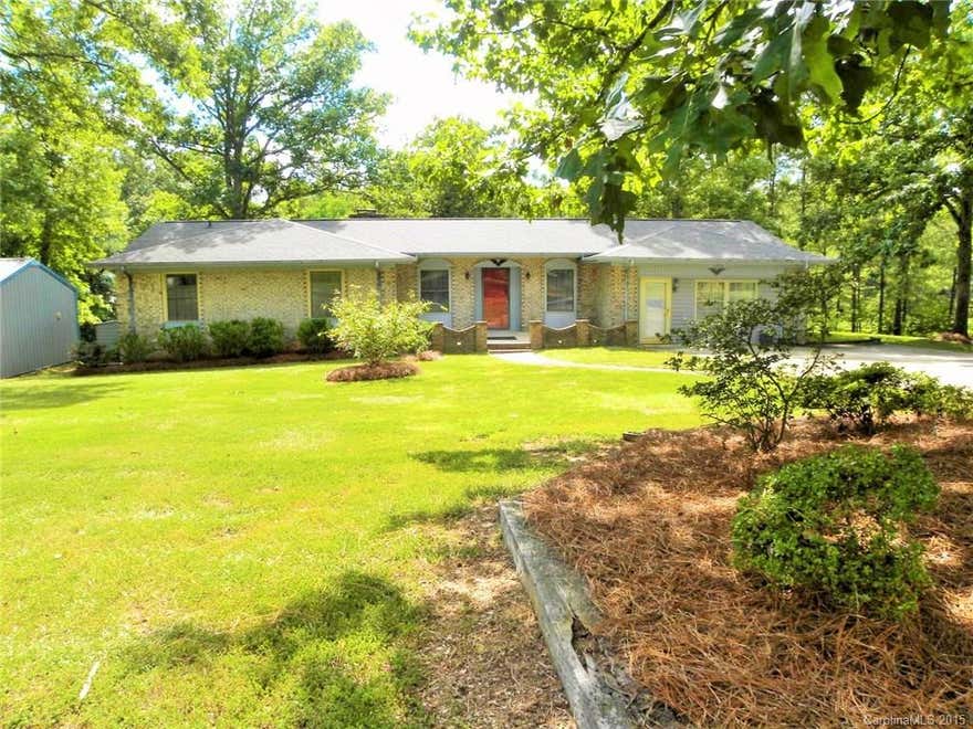 Endless possibilities with this home. So much square feet for the money. Home is well maintained. Every man's haven with wired shop measuring 400 sq ft.   Large deck overlooking private backyard. Hot tub on deck.