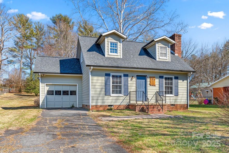 Welcome to 154 VFW Road! This classic Cape Cod style home features 3 bedrooms, 1.5 baths, and main level attached garage. The gorgeous fireplace provides a great focal point for the main living area and the open floor plan flows easily into the dining room and kitchen. A conveniently place laundry area, powder room/half bath, and bedroom finish out the main level. Upstairs you will find 2 generously more sized bedrooms, a full bath, and closet/storage area. Enjoy a cup of coffee or grill out on the back patio while the pets play in the fully fenced backyard without worries! This great home is less than 10 minutes from downtown Morganton and 5 minutes from the Catawba River Greenway. Check it out today!