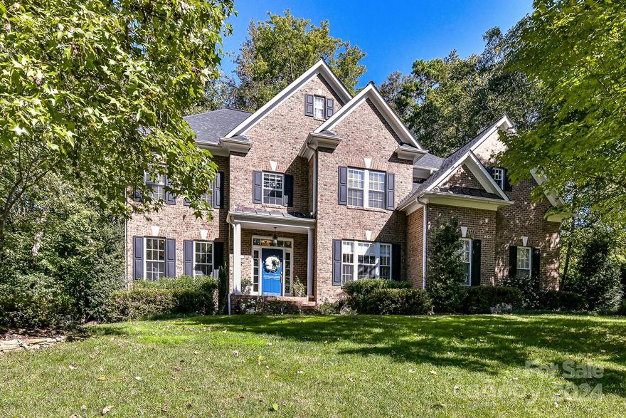 Wonderful brick home in Davidson’s desirable Cabin Creek neighborhood! 6 bedrooms & 4.5 baths on a private, 0.58 acre lot less than a mile from downtown Davidson & the Davidson College campus. Beautifully renovated kitchen (2023). Bedroom on main level can be used as an office, guest room or playroom. New roof in 2016, new HVAC in 2020 (downstairs) and 2014 (upstairs). Primary suite on the 2nd level plus 3 additional bedrooms: one w/ ensuite bathroom & 2 w/ shared bathroom. Third floor offers flex space for a rec room/office & has a half bath. Also has cozy play area through a special door! Tankless water heater, water filtration system and much more! Two garage w/ Tesla charger. New window screens & garage door motor. Beautiful landscaping & new irrigation system in 2020. Large deck & stone patio overlook backyard plus walking path. Sellers purchased spacious shed for extra storage. Great house in a very special neighborhood. 6th BR currently a craft room- 6 BRs hard to find anywhere!