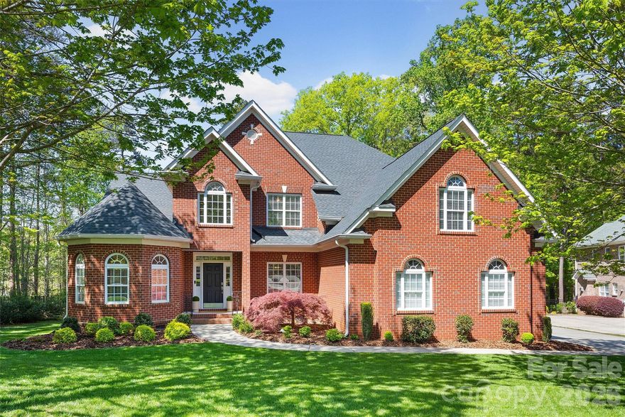 This stunning all-brick home blends timeless elegance with modern comfort, featuring rich hardwood floors throughout and a beautifully renovated gourmet kitchen designed for both function and style. The spacious kitchen is a true centerpiece, showcasing a massive island with an additional prep sink, gas cooktop, double wall ovens, designer cabinetry, elegant granite and quartz countertops, and a custom tile backsplash—perfect for entertaining and everyday living.

The main-level primary suite offers a private retreat with a luxurious spa-inspired bath, complete with a large frameless glass shower, jacuzzi tub, dual-sink vanity, and a custom closet system. An additional bedroom suite on the main floor with a full bath provides ideal flexibility for guests or multigenerational living.

Upstairs, you’ll find three generously sized bedrooms, two full baths, and an expansive bonus room—perfect for a media space, game room, or home gym. Dual staircases offer added convenience. Enjoy year-round relaxation on the screened-in porch, featuring adjustable panels for all-season comfort. Plus, there's bonus storage underneath the porch. A paver patio with a firepit and a private fenced backyard create a peaceful setting.

The oversized three-car garage and desirable cul-de-sac location add functionality and curb appeal. Major updates include the roof replaced in 2022, HVAC systems in 2016 and 2021, and the water heater in 2018.

Highly rated Weddington schools. This exceptional home offers a serene atmosphere just minutes from shopping, dining, and everyday amenities.