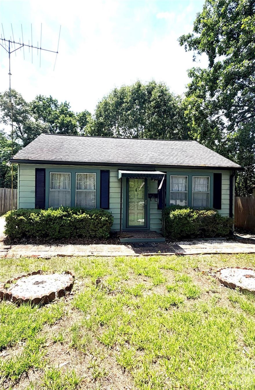 Cute bungalow for a starter home or investment property. This 2 Bed/1 Bath home is located in Hickory, near the new City Walk and downtown shopping, restaurants, and events. It has double driveways for ample parking. Inside is a large den and living room with bedrooms on the side. Kitchen, dining and bath are in the rear of house. There is a covered back deck and glass enclosed sunroom on the living room side. Fully fenced backyard with a storage building. Gas heat and air.